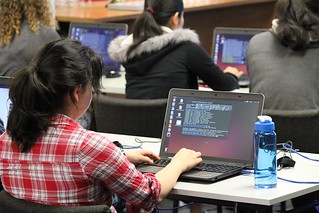 Student following the presenter along on her computer. Photo by Kristina Hoeppner