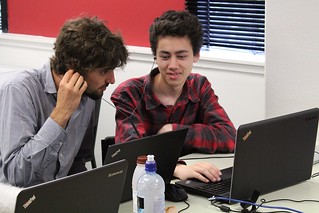 Student demonstrates to his Piwik mentor what he has been working on to improve accessibility. Photo by Kristina Hoeppner