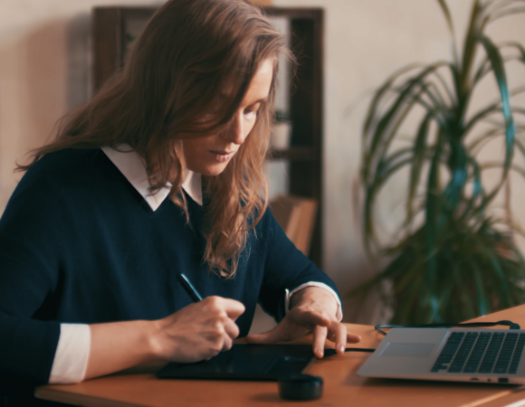 woman at computer writing_0