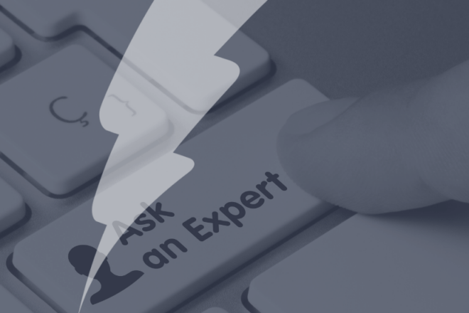 This image features a close-up of a computer keyboard with a hand hovering over the 