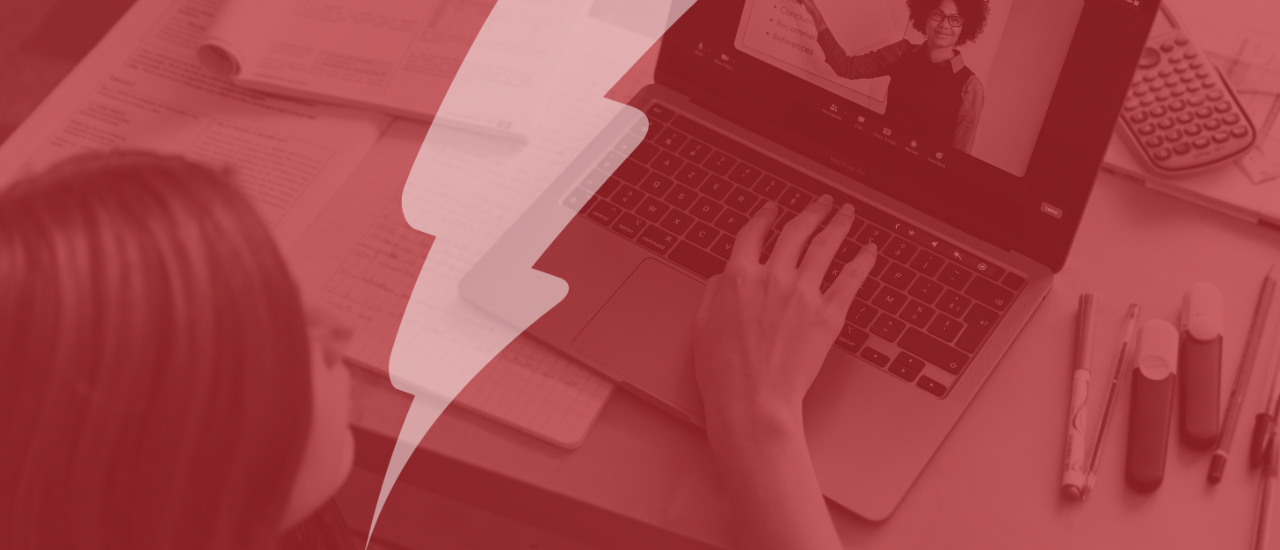 Student engages in an online learning session, watching a virtual lecture on a laptop while surrounded by study materials, notebooks, and stationery. The image is overlaid with Catalyst IT Europe's red lightning bolt branding.